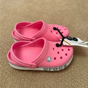 NWT. Crocs slip on clogs. Size J2